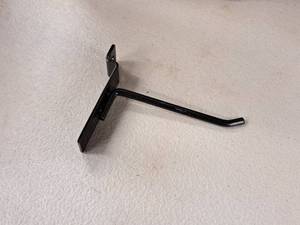 lot 1307 image: Lot of (25) 4 Slat Wall Pegs