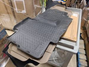 Assortment of new floor mats for vehicles