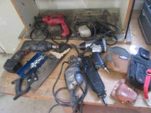 Assorted lot of pneumatic, electric and battery operated drills and impact drivers