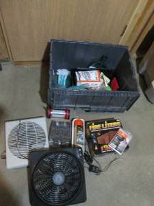 Clamshell tote full of assorted fans