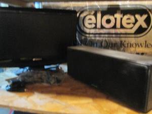 19 Sansui flat-screen TV and Polk Audio CS-250-S subwoofer