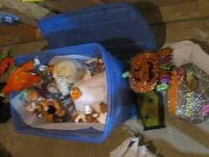 Covered tote containing a large variety of Halloween nik naks and decor. Some pieces are lighted