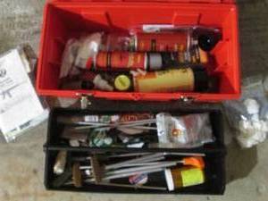 Plastic Toolbox full of gun cleaning supplies and accessories