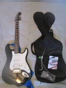 Fender 6-String Starcaster Electric Guitar includes Strap, Soft-Sided case, pick and extra strings