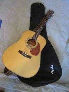 Cort 6-string Acoustic Guitar model EARTH70-NS. Includes strap, Soft-Sided Fender case and metal framed fold-up music stand.