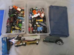 (2) Shoebox totes containing a large variety of die cast Hot Wheels cars, trucks, semis and more