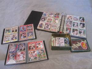Large assortment of Collectible trading cards from Topps, Donruss, Upper Deck, Fleer and more. Most cards are sorted into protective sleeves and reside in their respective albums