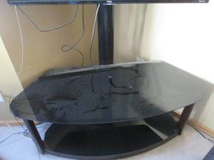 Dark Wood TV stand with Tinted glass surfaces. (does not include TV)
