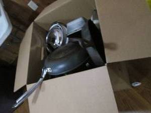 Massive box loaded with bread pans, cookie sheets and other bakeware along with pots, pans and other cookware