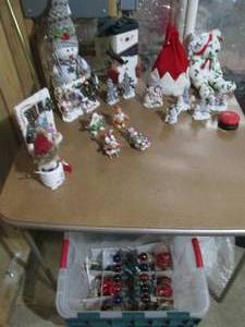Clamshell tote full of Snowman and Lil Babies Christmas decor