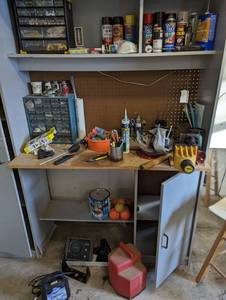 Shop Work bench cabinet and all content including bottle Jacks, Part organizers full of assorted hardware and other supplies, receiver hitch balls, battery charger and so much more