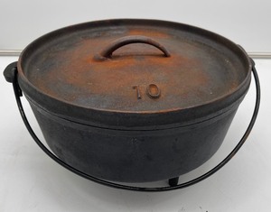 lot 24 image: Three Legged Cast Iron Dutch Oven with Lid Unmarked
