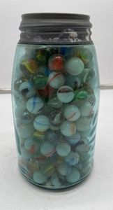 lot 31 image: Vintage Marbles in Blue Mason Jar