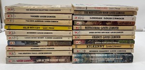 lot 51 image: Lot of 21 Louis LAmour Paperback Books  (Lot 1 of 2 similar lots)