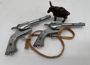 lot 65 image: Two small Circle K cap guns
