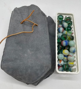 lot 149 image: Lot of 50 vintage shooter marbles with Marble Bag