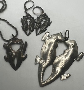 lot 307 image: Stamped Kissing Otters Pendant Large and small and earrings