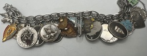 lot 311 image: Vintage Charm Bracelet with approximately 33 charms, some Sterling