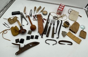 lot 277 image: Forged Strikers, Vent Picks, Antler Tip Awls, Nippers, Flint Lock