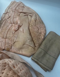 lot 195 image: Vintage Pink Baby Bonnets and baby clothing booties antique