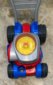 lot 141 image: Adorable Fisher Price Toy Lawnmower