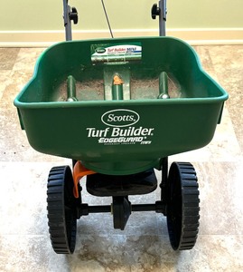 lot 143 image: ScottsTurf Builder Edge Guard Mini Broadcast Spreader
