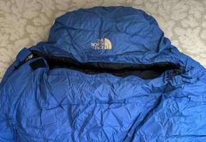 lot 192 image: Warm and Cozy Marmot and North Face Sleeping Bags