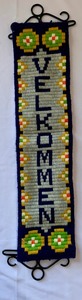 lot 253 image: Outstanding Collection of Handmade Afghan Blankets, Needlepoint Welcome Banner, Wool Poncho and More