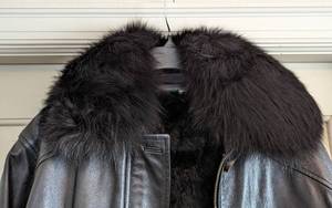 lot 213 image: Nina Ricci Black Leather and Fur Lined Jacket