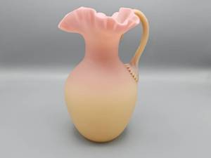 lot 66 image: Fenton Custard Glass Burmese Pitcher with Applied Handle