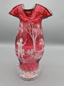 lot 44 image: Fenton Mary Gregory Collection Cranberry Hurricane Lamp with Boy