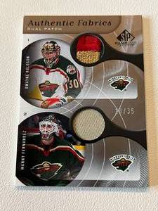 lot 329 image: Minnesota Wild Dual Goalie Patch Numbered 1035 - Manny Fernandez and Dwayne Roloson 2006 Upper Deck Authentic Fabrics#AP2-RF Minnesota Wild Hockey Card
