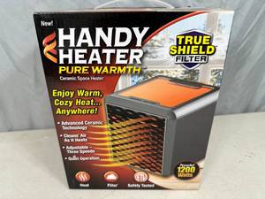 New Handy Heater Pure Warmth Ceramic Space Heater with LED Lights