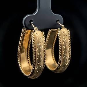 lot 52B image: Large Textured Satin & Diamond-Cut Twisted Rope Oblong Hoop Earrings in 14k Yellow Gold $1,140 Retail