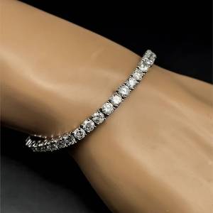 lot 22 image: Designer Oscar Friedman 10 Carat Diamond Tennis Bracelet in 18k White Gold w Appraisal $37,000