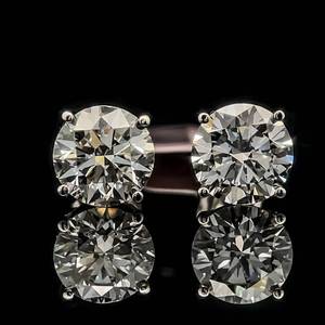 lot 17 image: 3 Carat Round Brilliant Diamond Classic Solitaire Stud Earrings in 14k White Gold, Retail Value $5,495 VIDEO