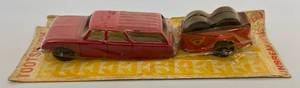 lot 77 image: Vintage Tootsie Toy Station Wagon With U-Haul Trailer With Tires (RARE) On Original Card (NIB)