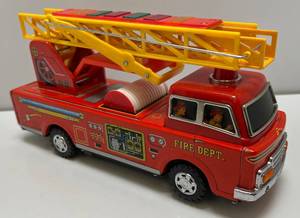 lot 128 image: Vintage WE Brand Tin Litho Battery Operated Bump-N-GO Fire Truck (Works Great)