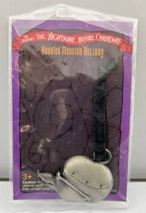 lot 210 image: Vintage Disneys The Nightmare Before Christmas Haunted Mansion Holiday (Toy Duck) Metal Ornamet (NIB)