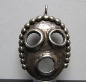 lot 12 image: Signed Thick Heavy Vintage Sterling Mask Pendant