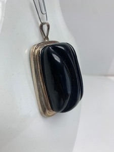 lot 2 image: HUGE Carved Black Tourmaline Modernist Sterling Silver Pendant by Burle Marx