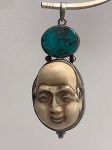 lot 22 image: Sterling Silver Carved Bone & Turquoise Oriental Face Pendant