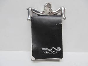 lot 24 image: Very Cool Retro Designer Figural Chrome Notepad Holder wNotepad by Carrol Boyes