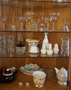 lot 45 image: Contents of Curio Cabinet Including Anchor Hocking, Pfaltzgraff Meissen, Noritake, Blue Onion, Tracy Porter, Crystal AND MUCH MORE