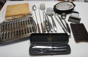 lot 56 image: The Kitchen Drawer...Carvel Two-Piece Carving Set, Grilling Utensils, Fajita Serving Hot Pads, Cutting Board, Broiler Pan...