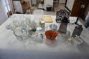 lot 62 image: The Kitchen Cupboard...Drink Glasses, Pyrex Glass and Cat Measuring Cups, Graters Etc.