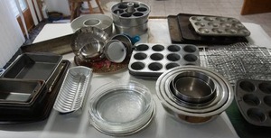 lot 65 image: The Kitchen Cupboard...Baking Pans, Cooling Rack, Angelfood Pan Set, Stainless Steel Bowl Set Etc.