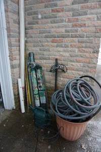 lot 313 image: Lawn and Garden...Water Hose, Planter, Crystal Clear Vinyl Sheeting NIB, Hose Reel Stake, Critter Netting Etc.