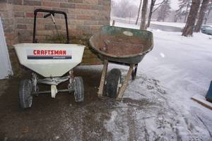 lot 315 image: Laen and Garden...Wheel Barrel and Fertilizer Spreader