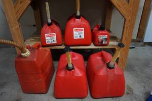 lot 329 image: Plastic Gas Cans...